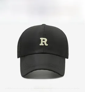 Detail of black quick-dry baseball cap with breathable mesh and R letter embroidery