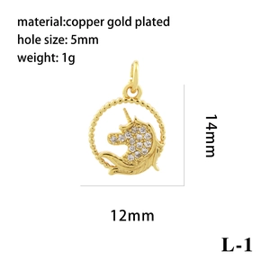 Macro view of a gold-plated unicorn charm with white cubic zirconia and sizing details