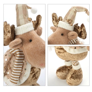 Detail of Christmas reindeer plush with golden sequins and knitted scarf for holiday decor