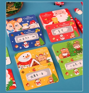 Close-up of colorful Christmas scratch cards with cartoon Santa, reindeer and snowman designs