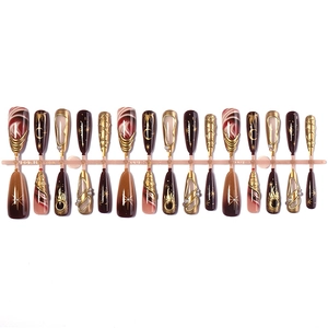 French almond press-on nails with leopard print and golden moon star 3D embossed designs