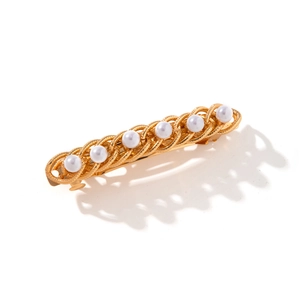 Elegant gold metal hairpin featuring seven white pearls in a woven chain design