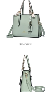 Detail of mint green PU leather tote bag with printed silk scarf and gold logo