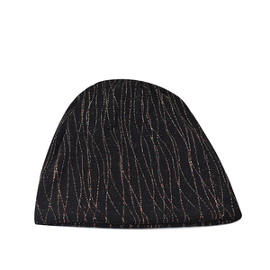 Macro detail of black knit beanie with wavy colorful metallic thread and shiny sparkles