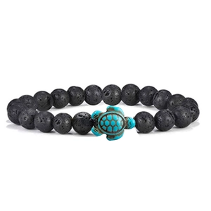 Elastic black lava stone beaded bracelet featuring a green turquoise turtle centerpiece