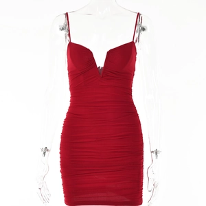 Detail of red ruched bodycon dress with deep V-neck and spaghetti straps in mesh fabric