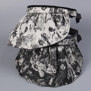 Detail of adjustable buckle and mountain print fabric on sun visor hats