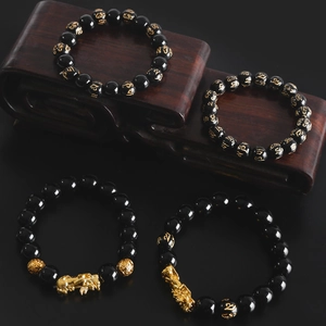 Obsidian style beaded bracelets with golden Pi Xiu charms and six-word mantras charms