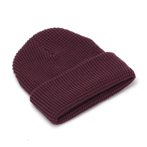 Classic deep burgundy knit beanie hat with thick waffle texture and wide folded cuff design