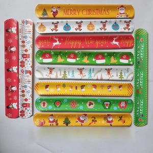 Flat lay collection of 11 colorful Christmas slap bands with festive holiday patterns