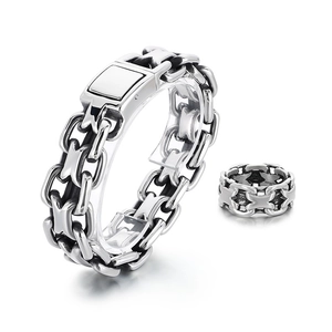 Silver stainless steel double chain bracelet with square buckle on white background