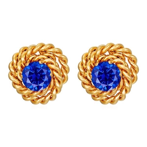 Detailed shot of vintage gold twist earrings with central blue zircon gemstone on white background