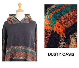 Detail view of dark grey knitted hooded shawl with orange stripes and fringe trim