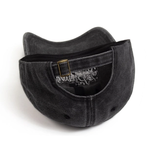 Rear view of washed grey baseball cap showing metal buckle and vintage cotton texture