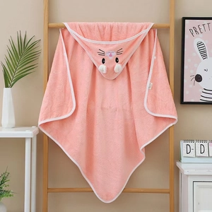 Detailed view of pink coral fleece baby hooded towel with cute bunny embroidery