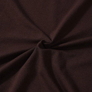 Macro texture of dark brown knit fabric with delicate wave lace stitching details