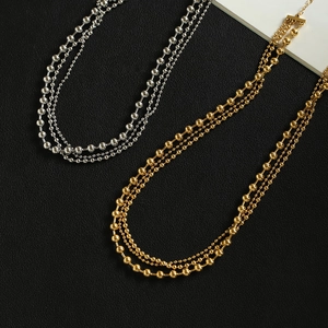 Three-layer layered ball chain necklaces in gold and silver finish on black leather