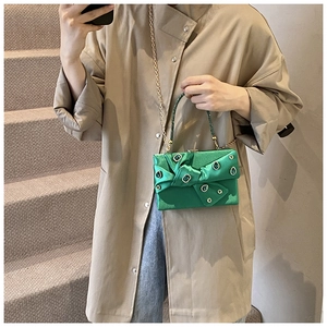 Green satin evening clutch with sparkling crystals and large decorative bow detail