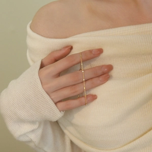 Minimalist S925 sterling silver gold bracelet with tiny round sequins on model