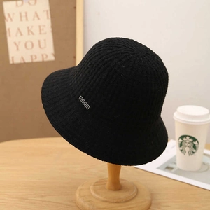 Stylish black knitted bucket hat for women with wool-like texture and side logo patch