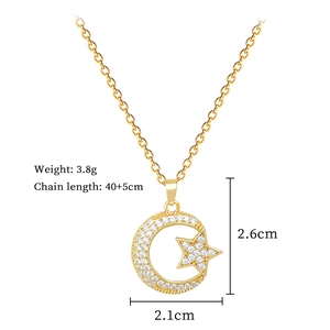 Detail view of gold star and crescent moon pendant with clear zircons and dimensions
