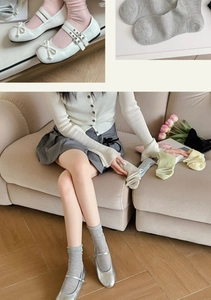 Detailed knit texture of pastel crew socks in various colors like pink and green