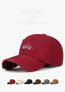 Detail of distressed baseball cap with embroidered 207 patch and worn edges texture