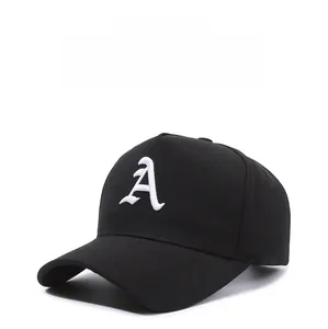 Close-up of gothic letter A embroidery on black cotton twill baseball cap fabric