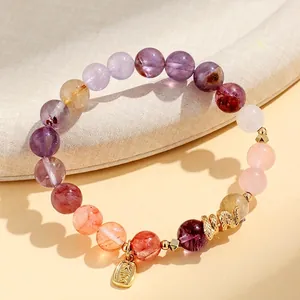 Zodiac Snake Year bracelet with amethyst and pink crystal beads plus lucky charm tag