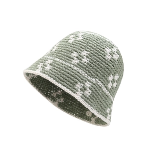 Handmade crochet flower bucket hat in sage green with white floral patterns