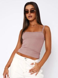 Detail of slim fit ribbed cotton camisole with delicate lace trim in soft mauve pink