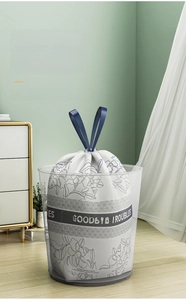 Close-up of drawstring garbage bag with floral print and convenient lift handle