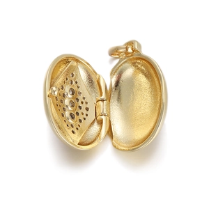 Detail view of an open 18K gold-plated oval locket pendant showing the inner compartment