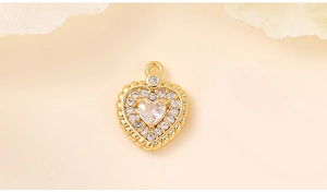 Macro shot of gold heart pendant with inlaid cubic zirconia and detailed craftsmanship
