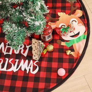 Red and black plaid Christmas tree skirt with reindeer motif and Merry Christmas text