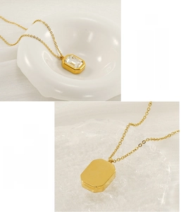 Detail of square zircon pendant showing front emerald cut and smooth back on gold chain