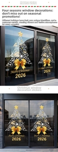 Detail von goldenem Weihnachtsbaum-Fensteraufkleber mit Rentier, Schneeflocken und Schleife
