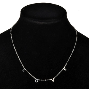 Silver stainless steel necklace featuring LOVE letter pendants on a black jewelry stand