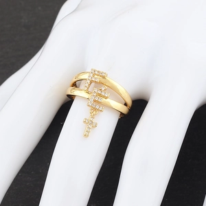 Macro detail of gold-plated double-band ring with micro-paved zircons and F-pendants