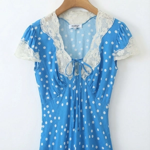 Blue retro polka dot dress with V-neck lace patchwork and delicate ribbon detailing