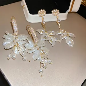Elegant pearl and zircon flower drop earrings with layered petals and long tassels