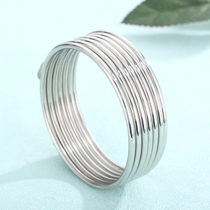 Detailed view of 2mm silver minimalist stainless steel layered stackable bangle