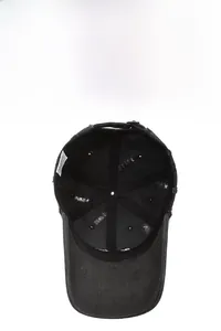 Detail view of cotton baseball cap interior showing reinforced seams and adjustable metal buckle