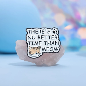 Cute enamel cat brooch with Meow pun slogan on pink stone decorative background