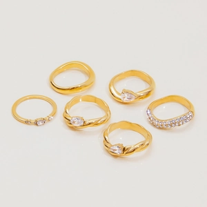 Detailed view of 6-piece gold-plated titanium steel ring set with sparkling zircon stones