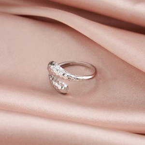 Macro shot of silver hammer texture on adjustable S925 sterling silver ring detail
