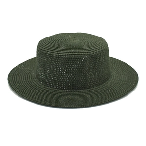 Detail of fine-woven dark green straw boater hat with a flat brim and crown
