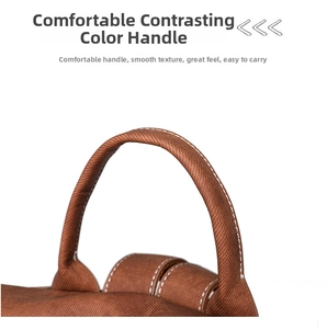 Detail of canvas backpack with round brown handle and contrast white stitching details