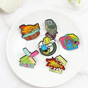 Creative enamel pin set featuring windmill, owl, rainbow boat and cartoon milk box icons