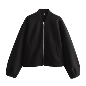 Detail of the size S label and metallic silver zipper on this black stand-collar jacket